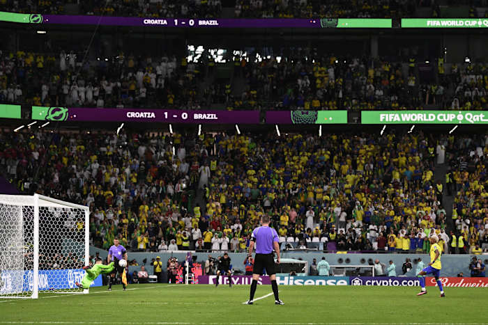 Dominik Livakovic pictured saving a penalty from Rodrygo during Croatia's win over Brazil in a penalty shootout at the 2022 FIFA World Cup